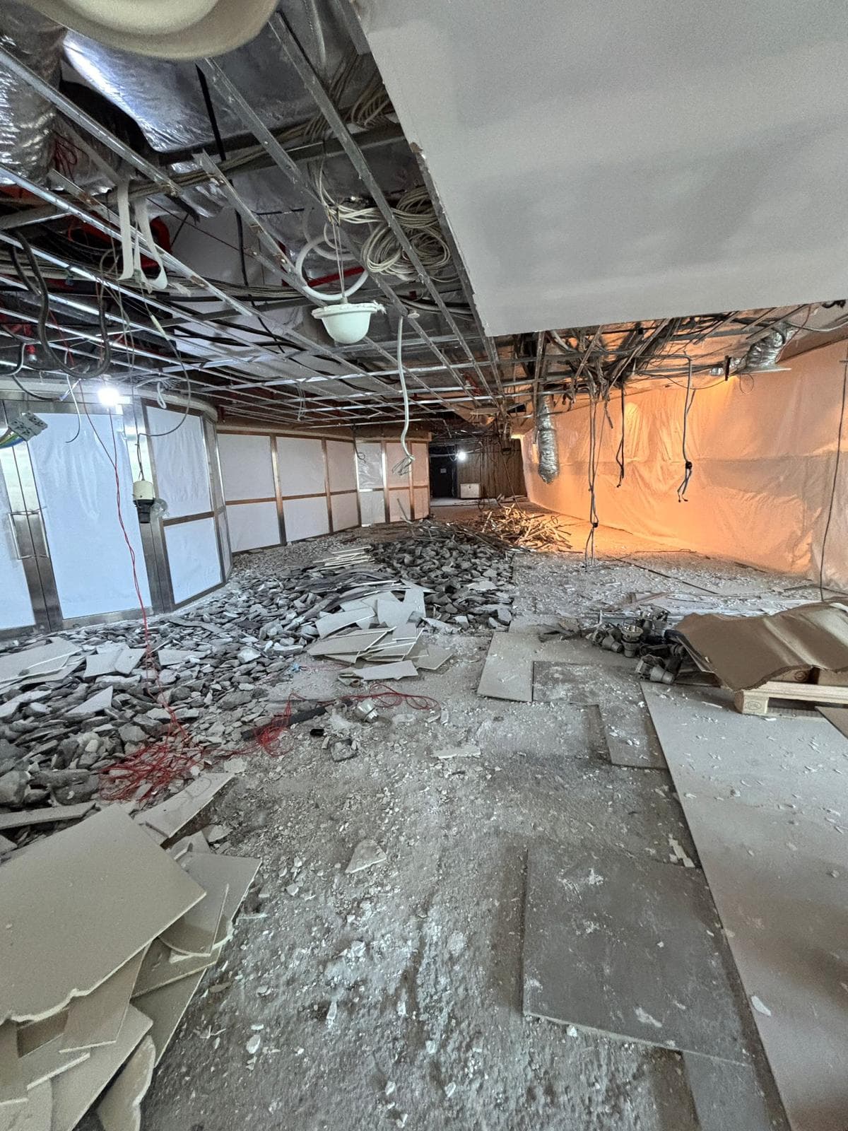 Shaw Lido cinema area during strip-out, with ceiling and floor finishes removed