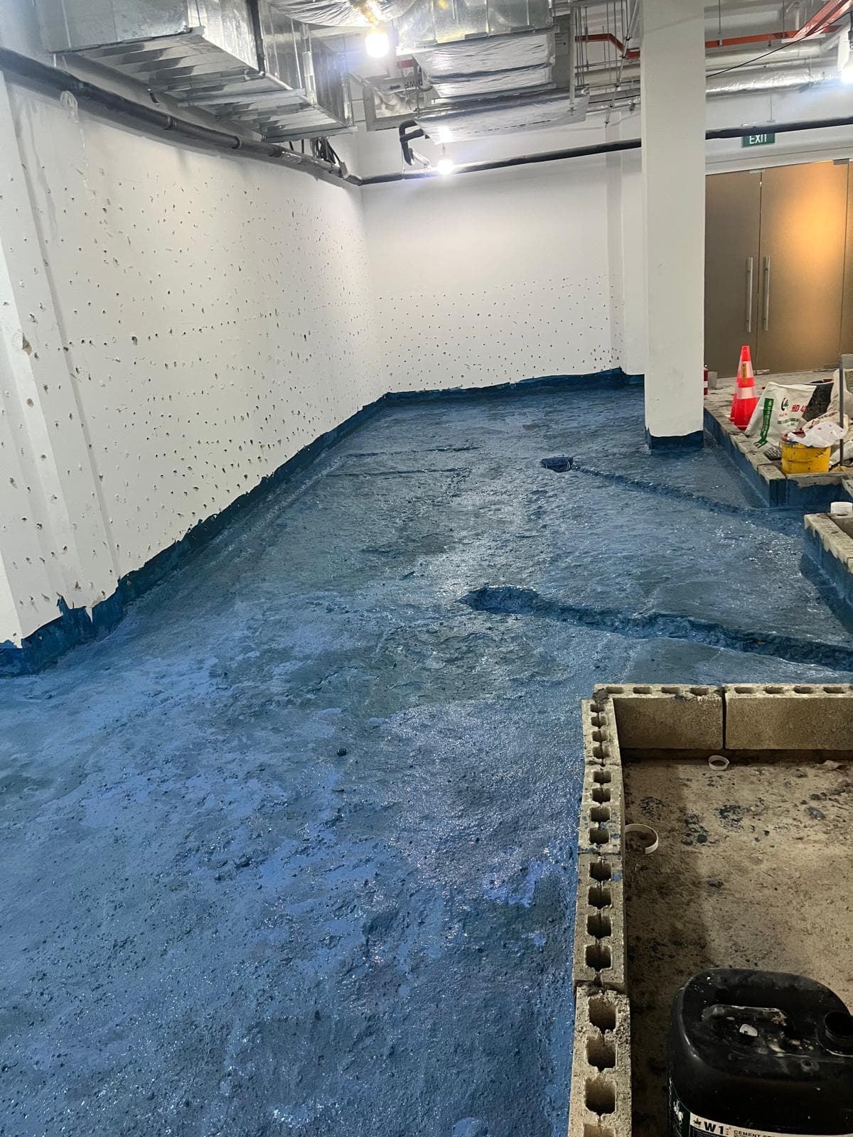 Waterproofing membrane applied across the LIORA restaurant floor during construction