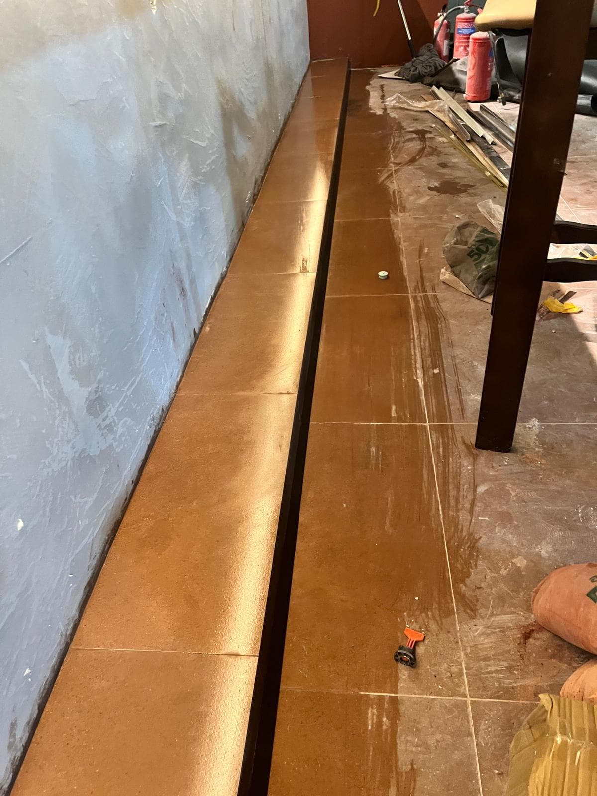 Tiled floor edge detail during the LIORA restaurant fit-out